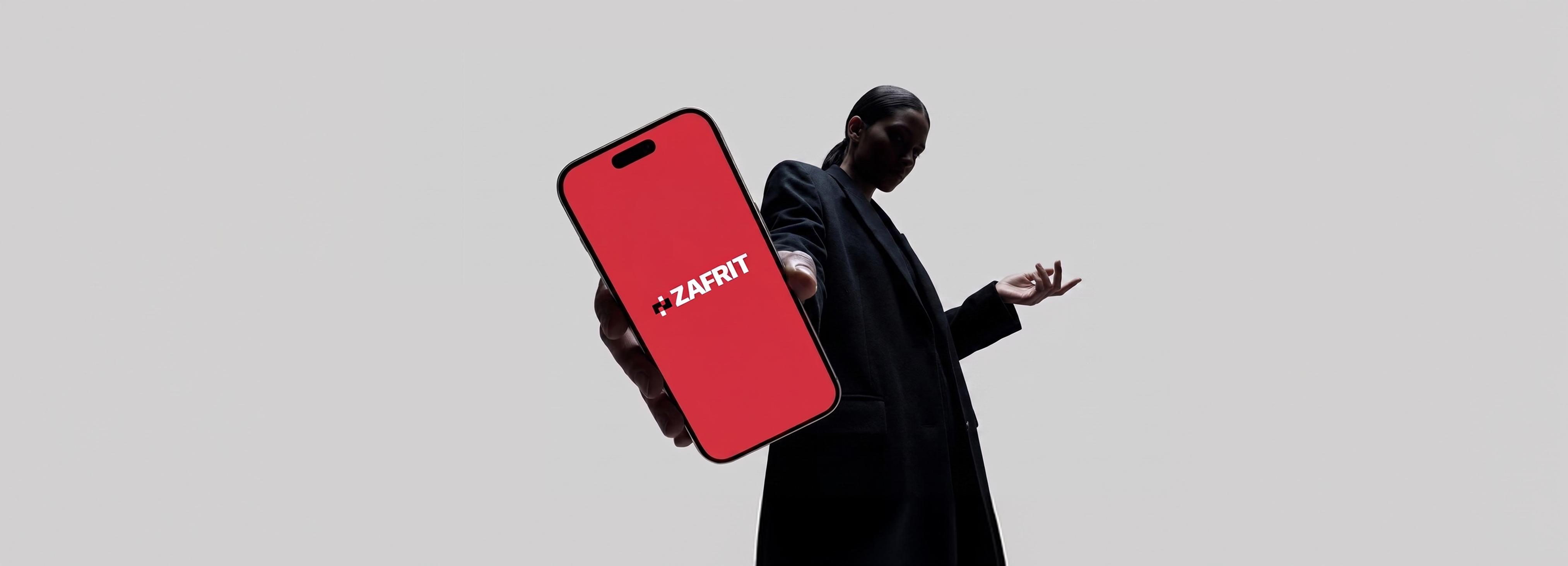 Person holding phone with ZAFRIT app